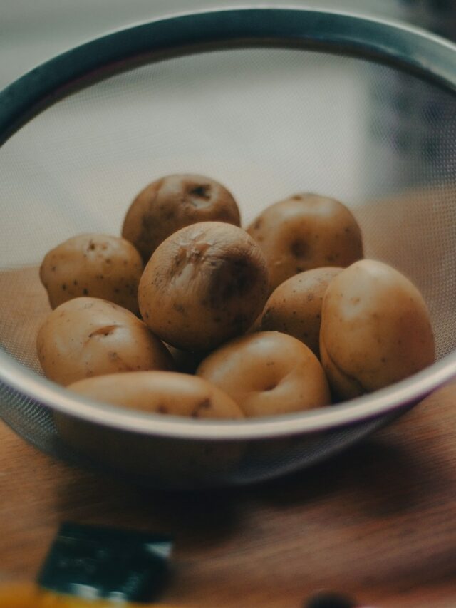 brown round fruits on white ceramic bowl