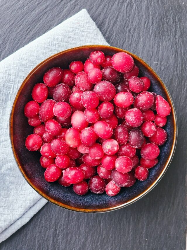 a bowl of frozen berries on a table