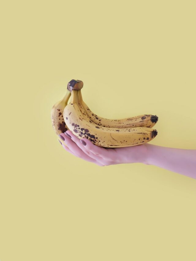 person holding yellow banana fruit