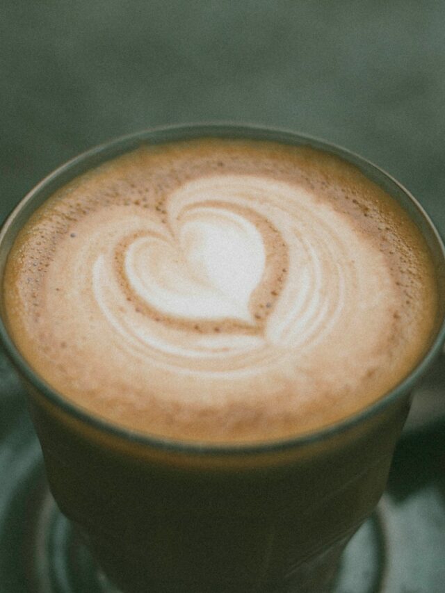 closeup photo of ceramic coffee mug with brown liquid inside