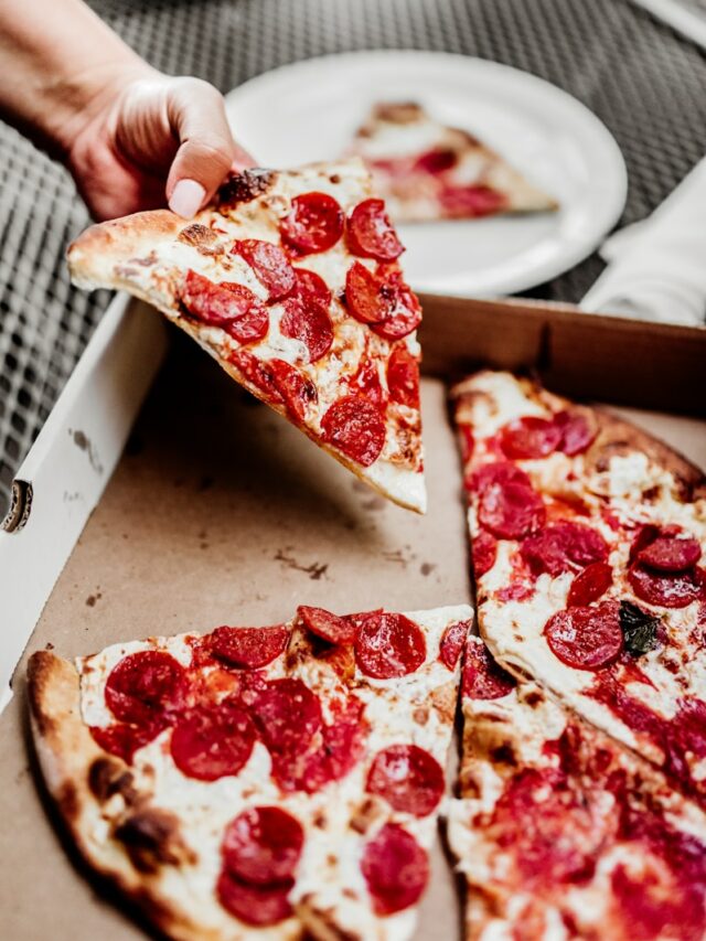 sliced pizza on white ceramic plate