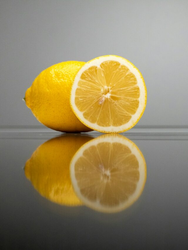 a couple of lemons sitting on top of a table