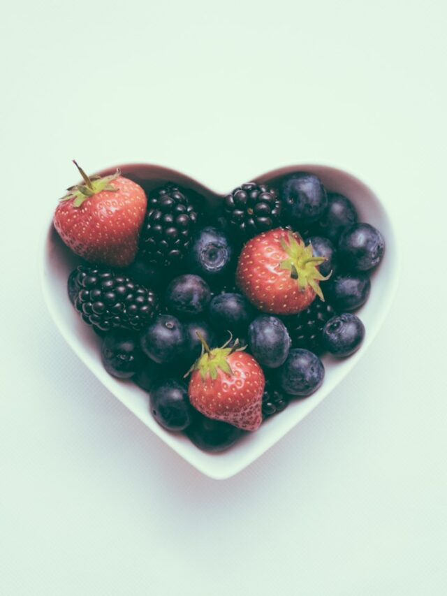 heart-shaped bowl with strawberries