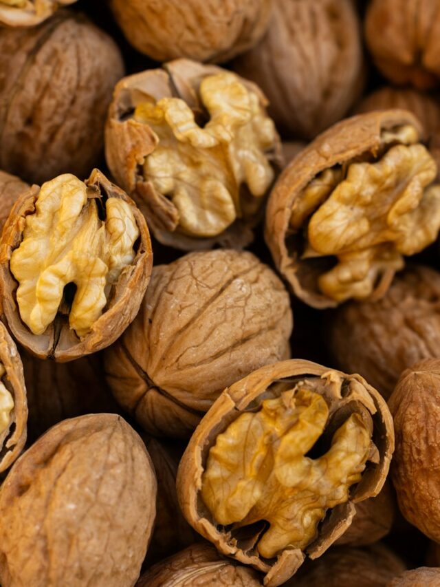 a pile of walnuts that have been opened