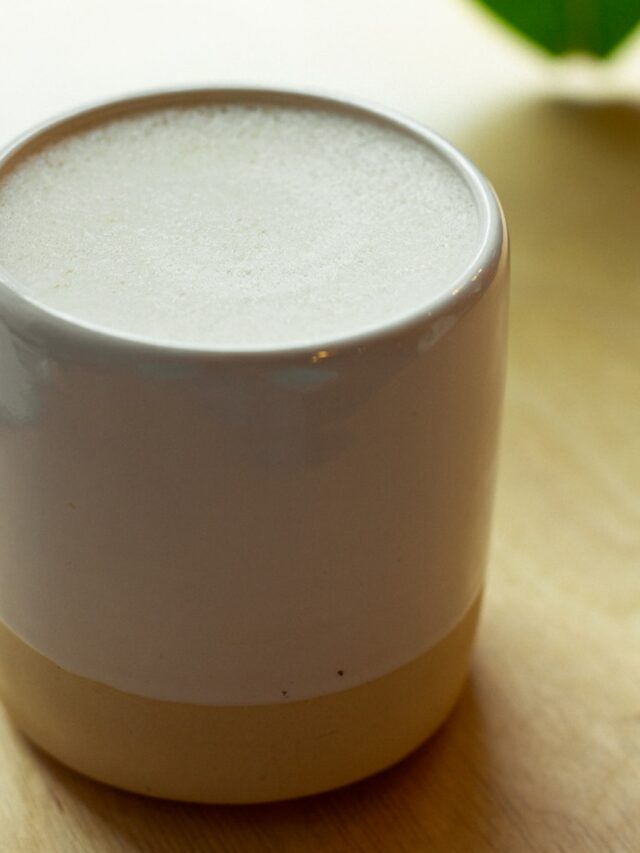 white and brown ceramic mug