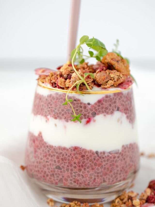 strawberry cake with green leaves on white ceramic plate