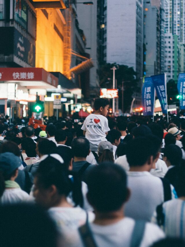 group of people standing near building