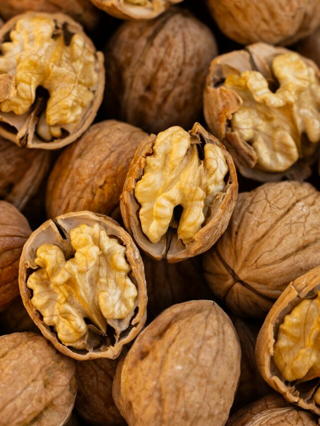 a pile of walnuts that have been opened